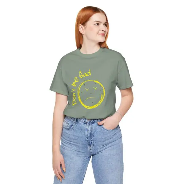 Woman wearing "Don't Be Sad" t-shirt.