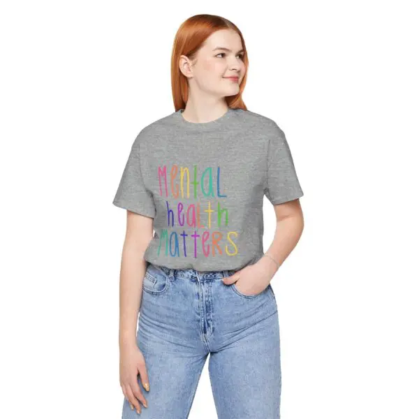 Woman wearing "Mental Health Matters" t-shirt.