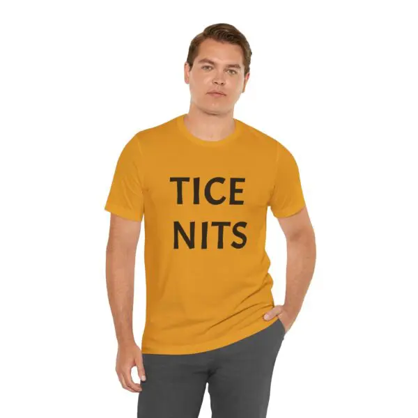 Man wearing a yellow "TICE NITS" shirt.