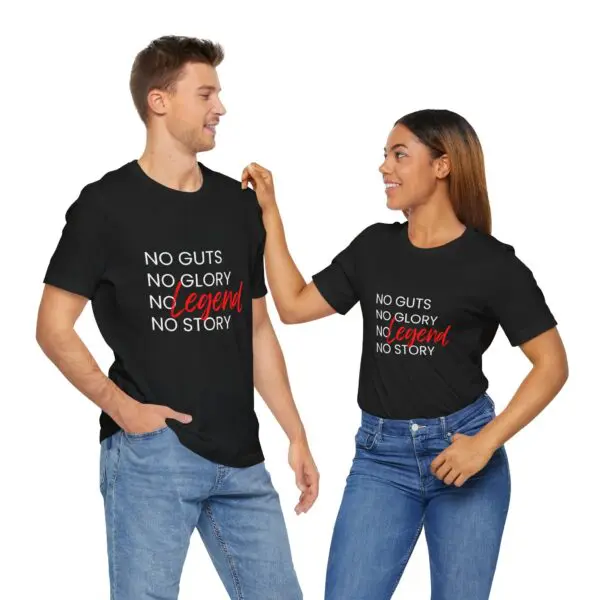 Two people wearing matching motivational shirts.