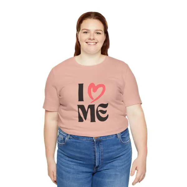 Smiling person wearing "I love me" shirt.