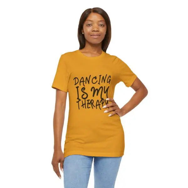 Woman wearing "Dancing is My Therapy" shirt.