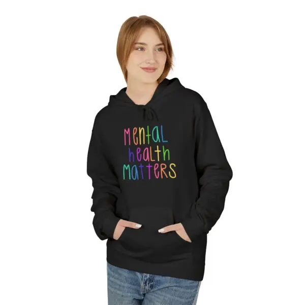 Person wearing "Mental Health Matters" hoodie.
