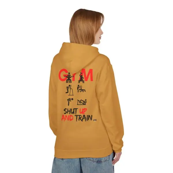 Person wearing hoodie with motivational gym design.