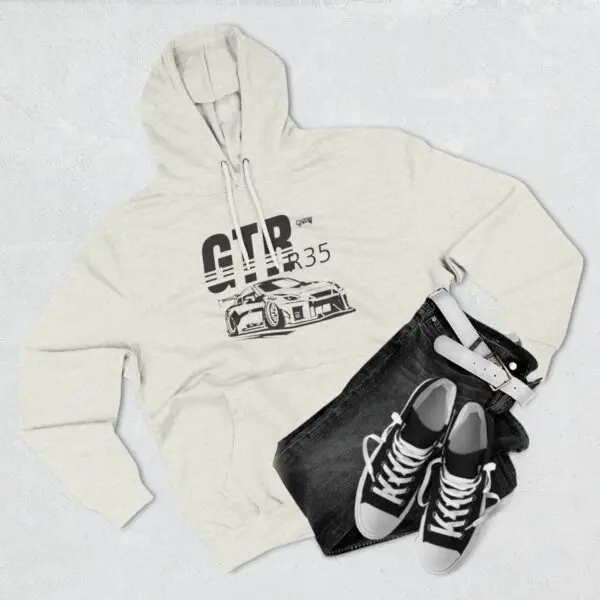 Hoodie, jeans, sneakers, and belt ensemble.