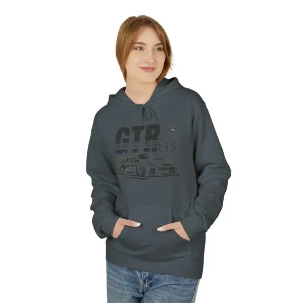 Woman wearing dark hoodie with car graphic.