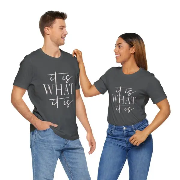 Couple wearing matching "It is What It Is" shirts.