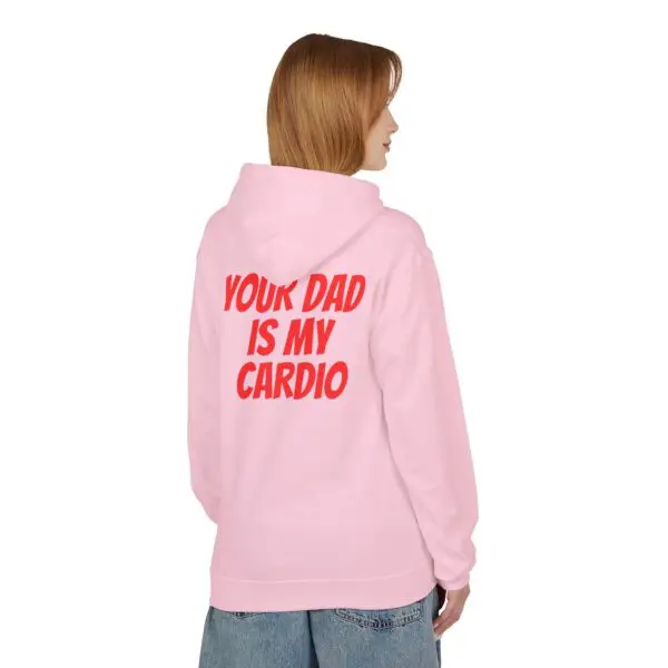 Person wearing pink hoodie with bold text.