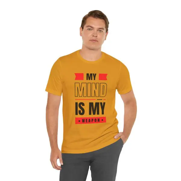 Man wearing "My Mind Is My Weapon" shirt.