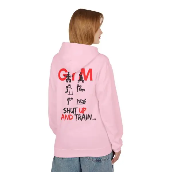 Person wearing pink hoodie with gym design.