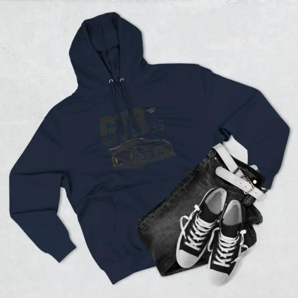 Hoodie, jeans, sneakers, and belt flatlay.