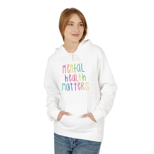 Person wearing "Mental Health Matters" hoodie.