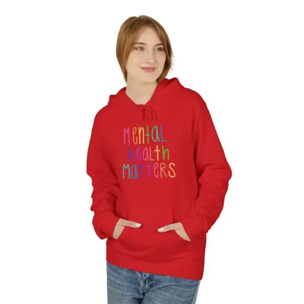 Person wearing red "Mental Health Matters" hoodie.