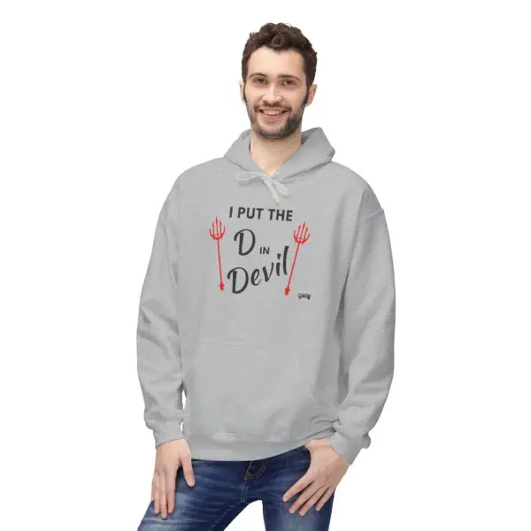 Man wearing humorous gray hoodie, smiling.