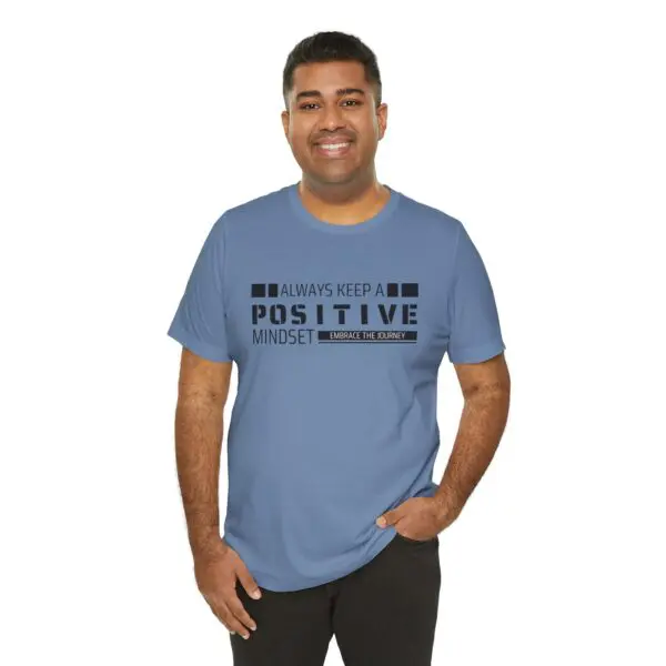 Man wearing a positive mindset t-shirt.
