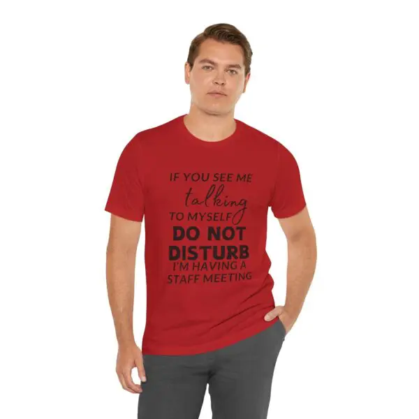Man wearing red shirt with humorous text.