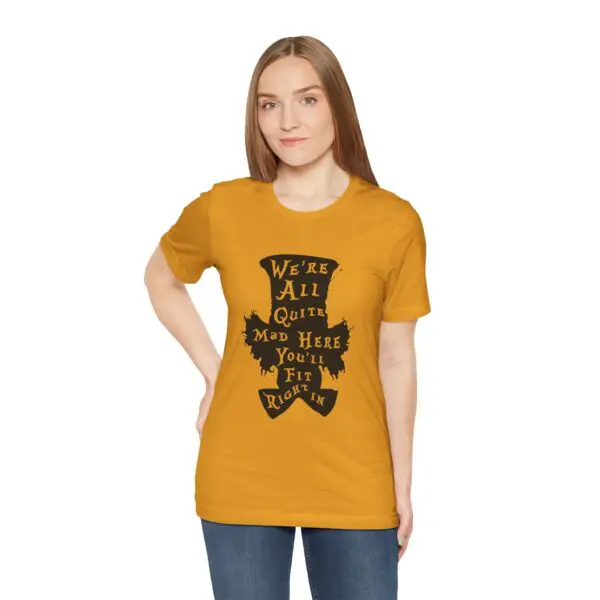 Woman wearing yellow shirt with black text.