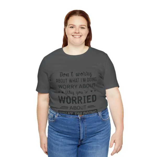 Smiling person in a graphic t-shirt.