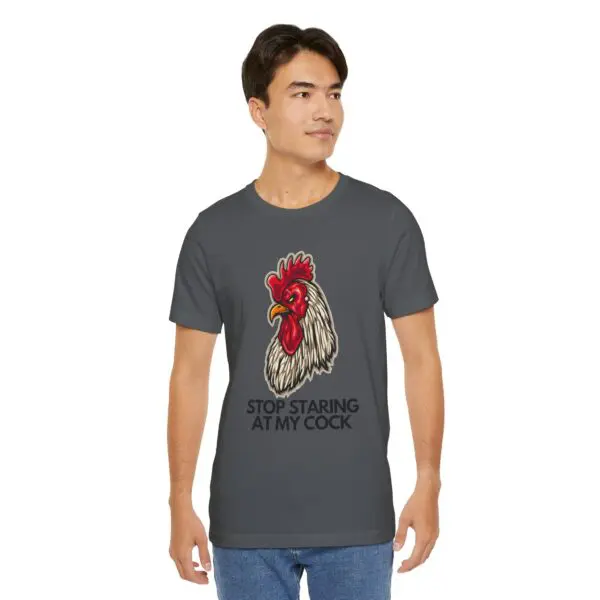 Man wearing rooster graphic t-shirt, humorous text.