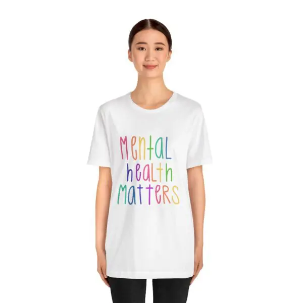Person wearing "Mental Health Matters" t-shirt.