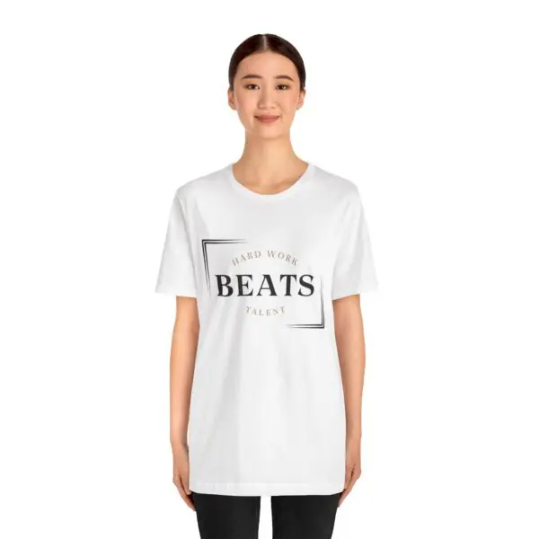 Person wearing "Hard Work Beats Talent" shirt.