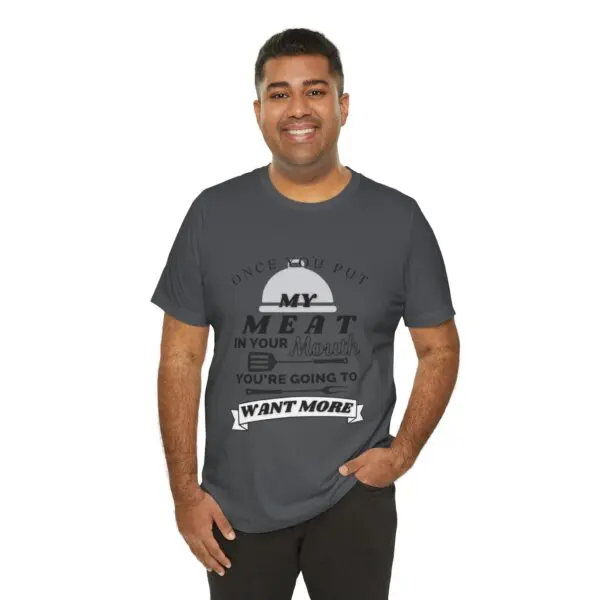 Man wearing a humorous graphic t-shirt.