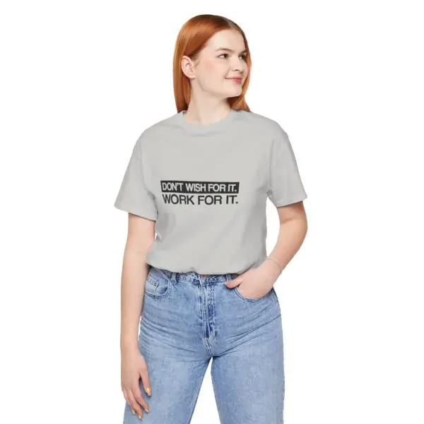 Woman in motivational t-shirt and jeans.