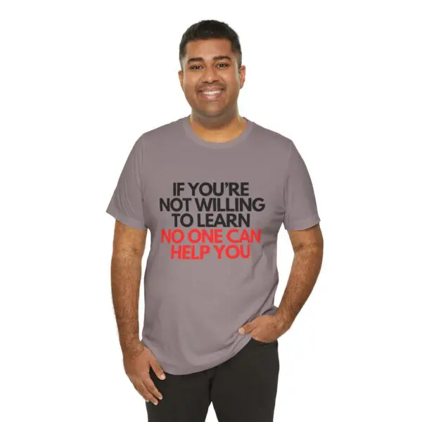 Man in motivational message t-shirt smiling.