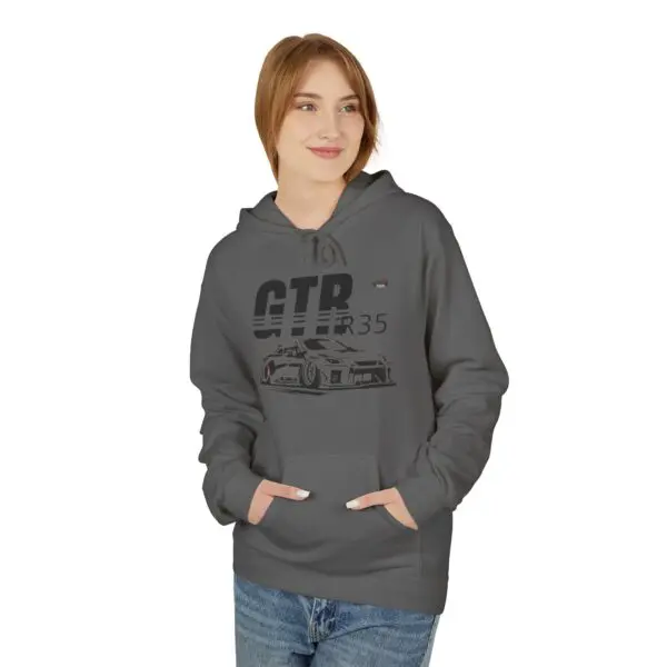 Woman wearing gray CTR35 hoodie, smiling.