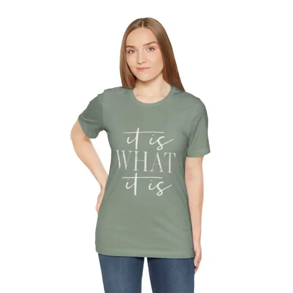 Woman wearing "It is what it is" shirt.