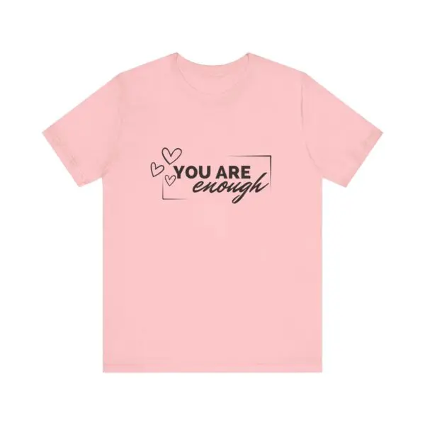 Pink shirt with "You Are Enough" text.