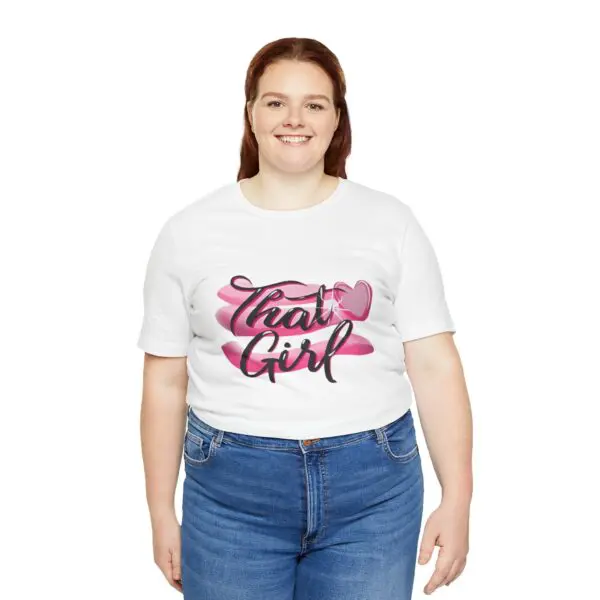 Woman wearing "That Girl" t-shirt, smiling.