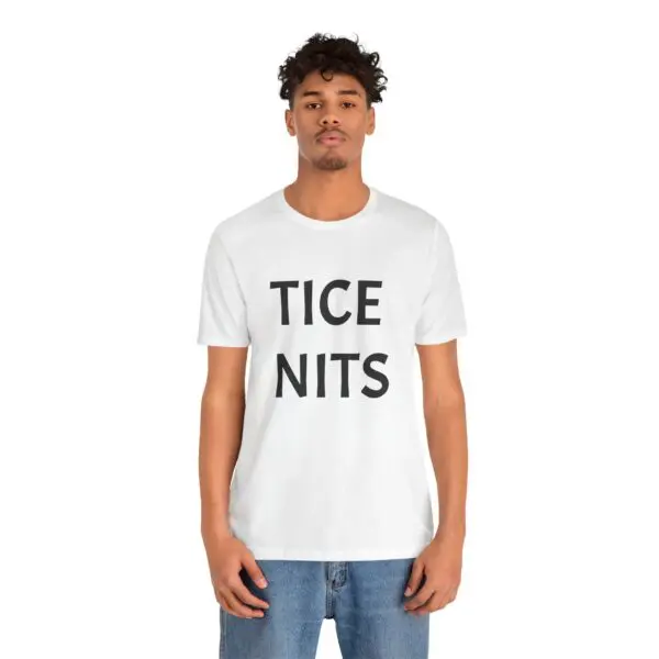 Man wearing t-shirt with printed text.