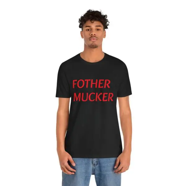 Man wearing black shirt with red text.