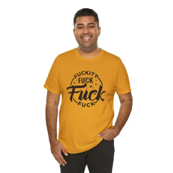 Man wearing mustard t-shirt with bold text.