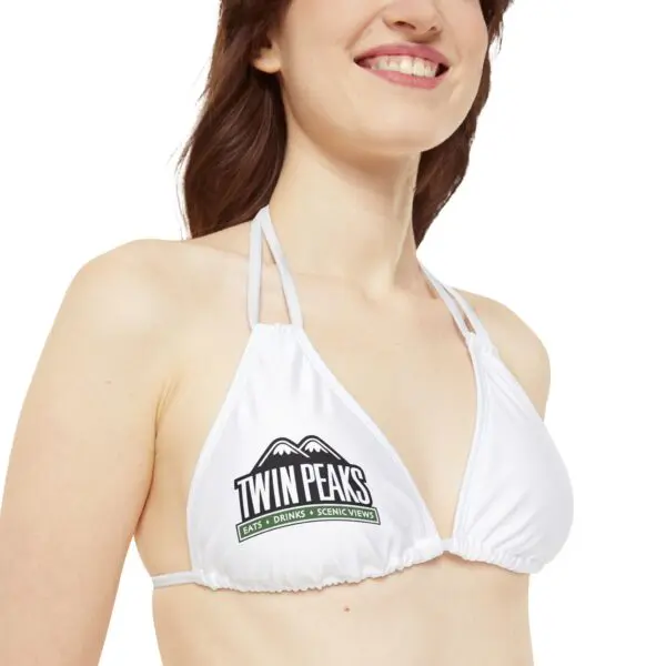Woman wearing white Twin Peaks bikini top.