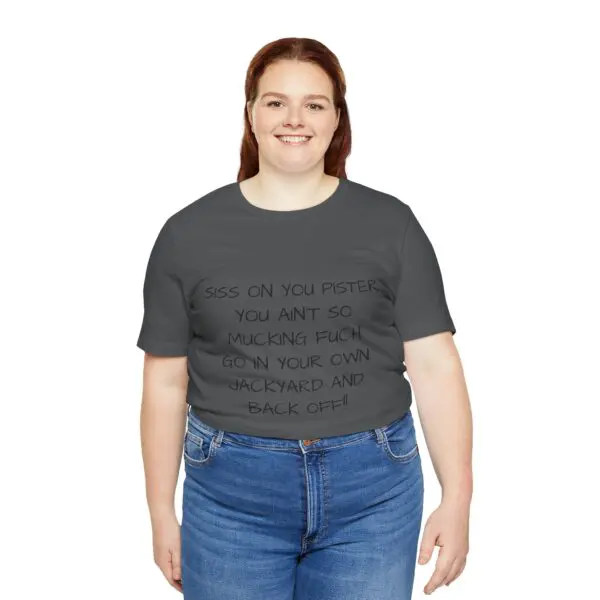 Smiling person wearing a printed t-shirt.