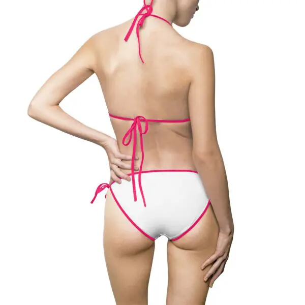 Woman wearing white and pink bikini.