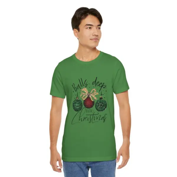 Man wearing green Christmas-themed t-shirt.
