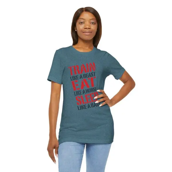 Woman wearing motivational t-shirt, blue jeans.
