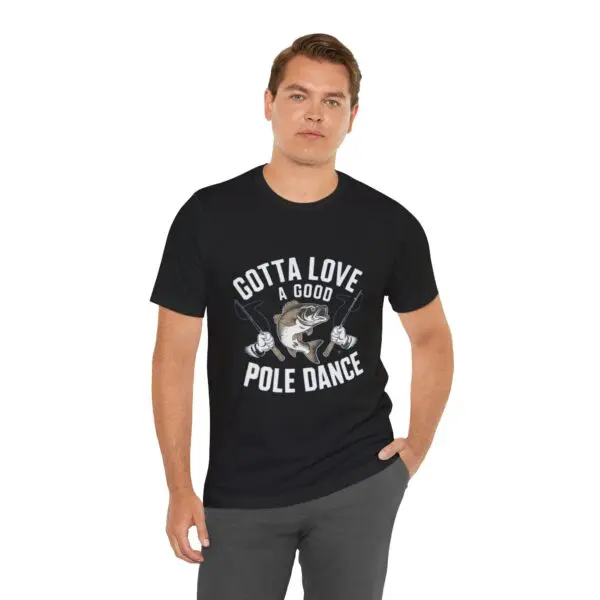Man wearing "Gotta Love Pole Dance" shirt.