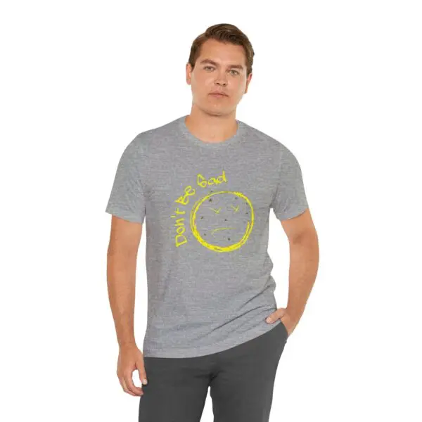 Man wearing gray "Don't Be Bad" t-shirt.