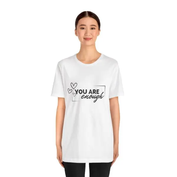 Woman wearing "You Are Enough" T-shirt.