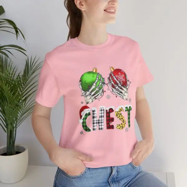 Woman wearing festive pink chest-themed shirt.