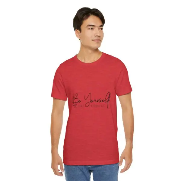Man wearing red "Be Yourself" t-shirt.