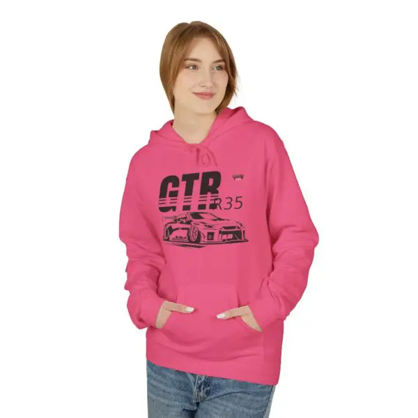 Woman wearing pink car-themed hoodie.