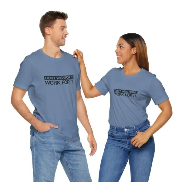 Two people wearing motivational slogan t-shirts.