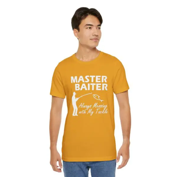 Man wearing yellow fishing-themed t-shirt.