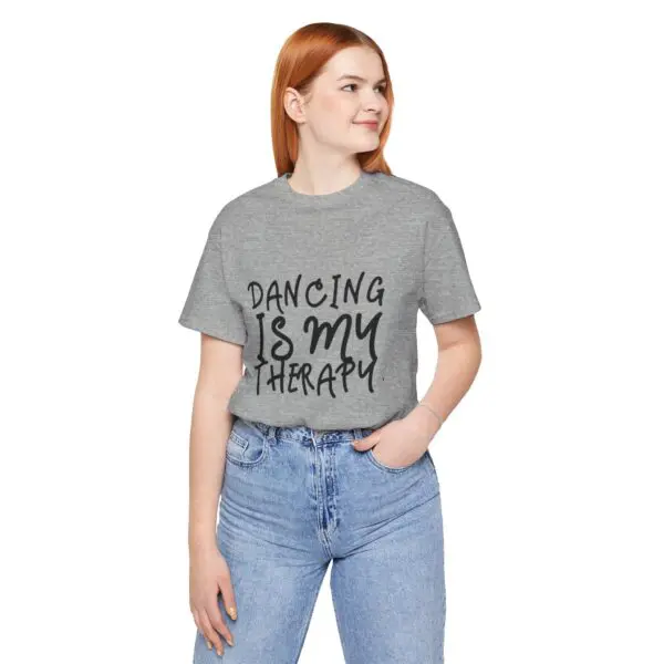 Woman wearing "Dancing is my therapy" shirt.