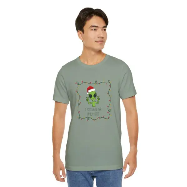 Man wearing alien-themed Christmas t-shirt.